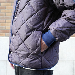 NANGA×MANUAL ALPHABET CMR REVERSE DOWN JACKET